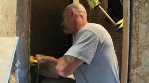 man working on building
