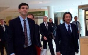 Mayor Don Iveson and Oilers owner Daryl Katz stroll into a news conference Tuesday at city hall.