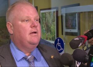 Mayor Rob Ford speaks to reporters on Tuesday