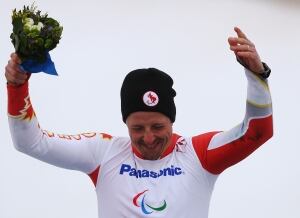 Josh Dueck celebrates his gold medal in Sochi