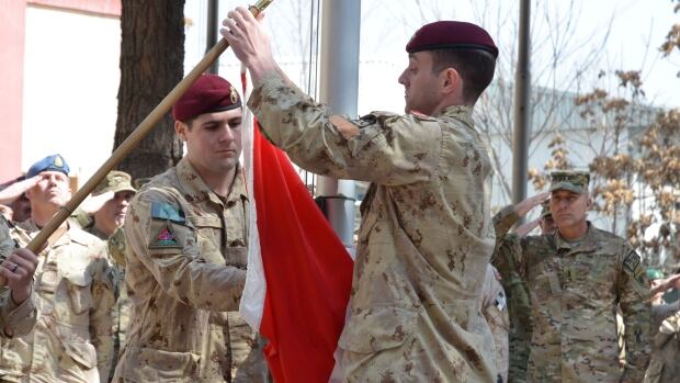 Feds hire job-hunting firm for veterans Canadian-flag-lowered-in-afghanistan