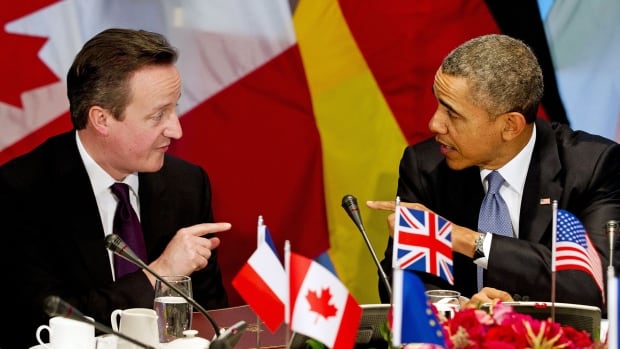 British Prime Minister David Cameron, left, and U.S. President Barack Obama participate in a G7 leaders meeting during the Nuclear Security Summit in The Hague Monday. The G7 leaders declared support for Ukraine while condemning Russia's "illegal" annexation of Crimea and suspending participation in G8 meetings until Russia "changes course."