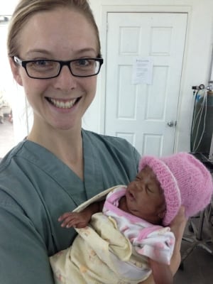 Natalie Bridger with abandoned baby in Haiti