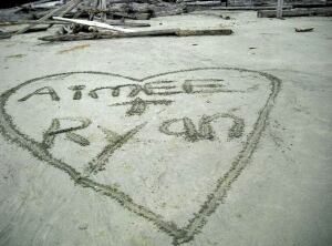 Amy Parkes and Ryan Quigley - heart in sand - Facebook photo