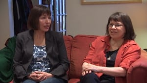 Natasha Griffiths (left, Susan Griffiths' daughter) reminisces with friend Cindy Rublee (right)