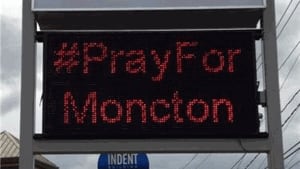 #PrayforMoncton sign posted outside a business