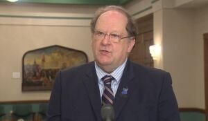 Premier Tom Marshall speaks with reporters