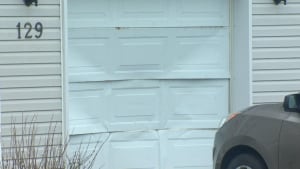 Damaged garage door on Penney Crescent