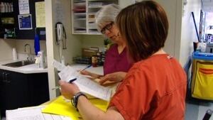 Two nurses at a nursing station