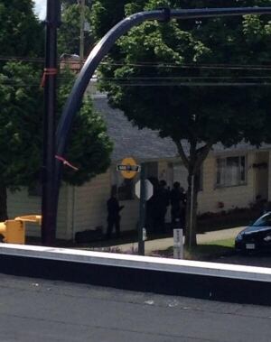 Police ERT team enter house believed to hold axe-wielding man