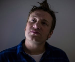 Jamie Oliver poses for a photo in Toronto in October 2013