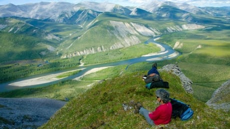 Relaxing in the alpine terrain above the Hart River. Peel watershed