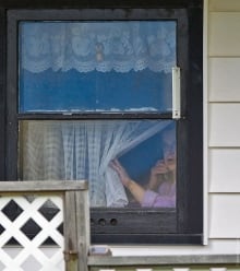 Woman watches police activity during Moncton shootings
