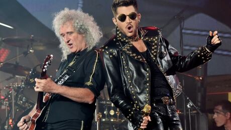 Musician Brian Mayof Queen and singer Adam Lambert perform at the Forum on July 3, 2014 in Inglewood, California. Brian May and Adam Lambert