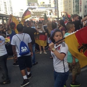German flags waving at Yonge-Dundas Square