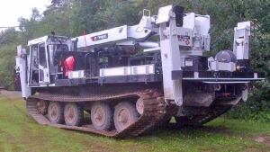 NB Power crews are using a marooka to get through Arthur debris in Fredericton