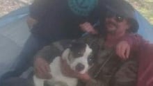 Sean poses with his dog Chico and friends.