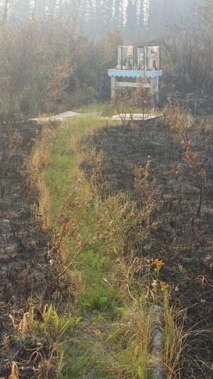 Wildfire leaves roadside shrine untouched