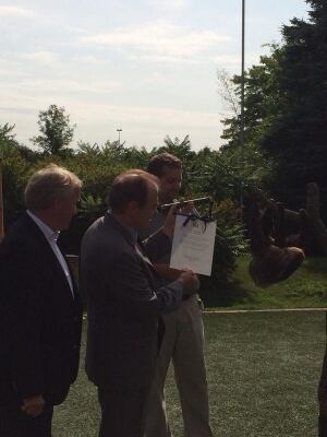 Norm Kelly presents sloth with scroll
