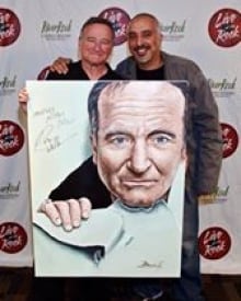 Robin Williams poses with Dave Benning, portraitist
