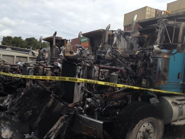 Three dump trucks destroyed in suspicious fire at Rusty's Towing in Richmond, B.C.