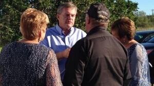 David Alward and a woodlot owner