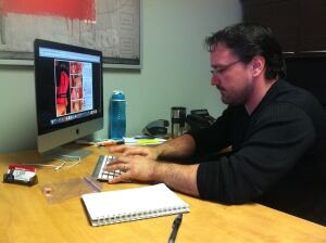 Matt Evans with photos of blade in candy
