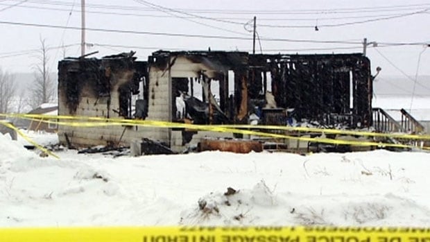 A home badly burned with the roof gone.
