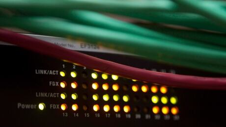 Lights on an internet switch are lit up as with users in an office in Ottawa, on February 10, 2011. The privacy watchdog is calling on federal authorities to keep better track of informal requests to telecommunications companies for subscriber data after finding shoddy record-keeping at the RCMP. THE CANADIAN PRESS/ Online Surveillance 20141030