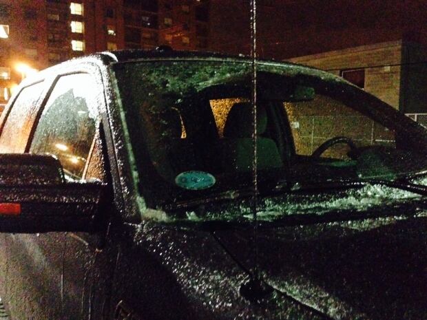 Ice-covered truck in parking lot