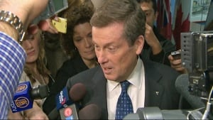 Mayor John Tory speaks with reporters