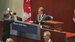 Mayor John Tory sitting in mayor's chair
