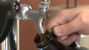 NB Liquor growler pouring