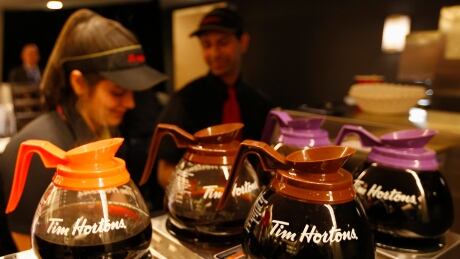 Tim Hortons employees prepare coffee before the company's annual general meeting in Toronto, May 8, 2014. A new study from research firm NPD Group says Canada's food
services industry will grow by less than one per cent annually over the next five years. TIM HORTONS