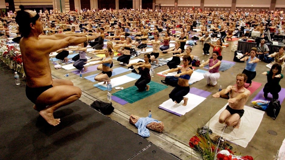 Bikram Choudhury, front, founder of Bikram yoga, a type of hot yoga. A sixth woman has filed a lawsuit against the 69-year-old for sexual assault or harassment.