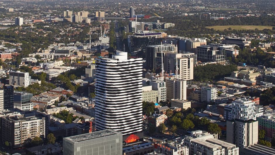 An newly-build apartment tower in Melbourne, Australia has the face of indigeneous leader William Barak etched into the balconies.