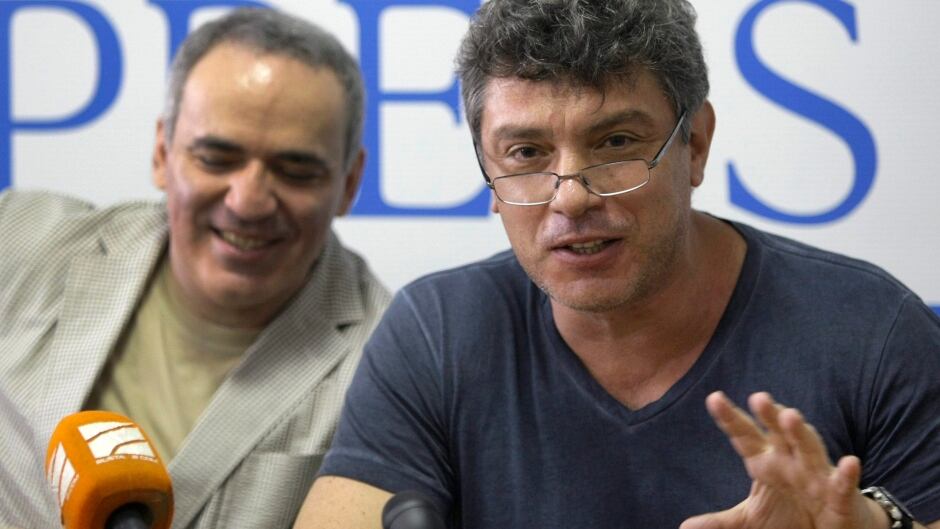Boris Nemtsov, the leader of Russian opposition party Parnas (People's Freedom Party) and Garry Kasparov former world chess champion and opposition leader, left, seen during a press conference in Moscow, Russia, Thursday, June 30, 2011. (AP Photo/Misha Japaridze)