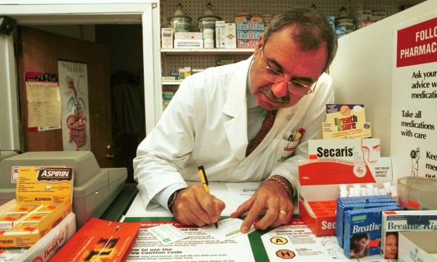 doctor writing prescriptions