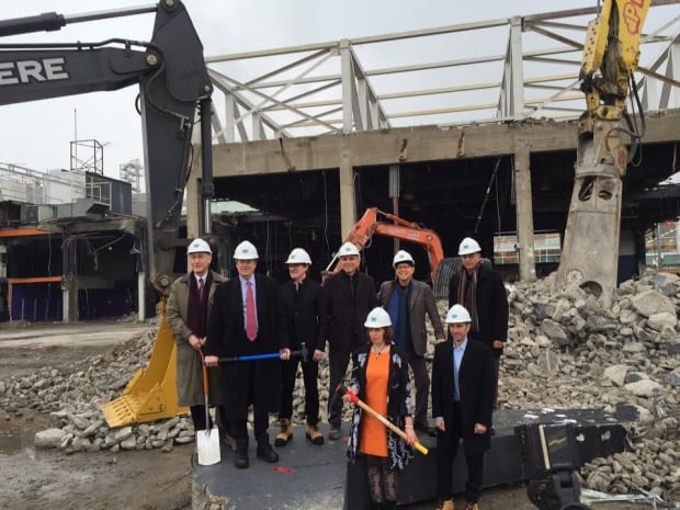 Mayor John Tory and others stand at the site where the Guvernment nightclub once stood.