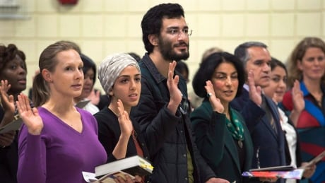 New Canadians take the oath of citizenship at a ceremony in Dartmouth on October 14, 2014. The government will release its immigration plan for 2015 today, and it's expected to show an increase in overall numbers. Immigration Levels 20141031
