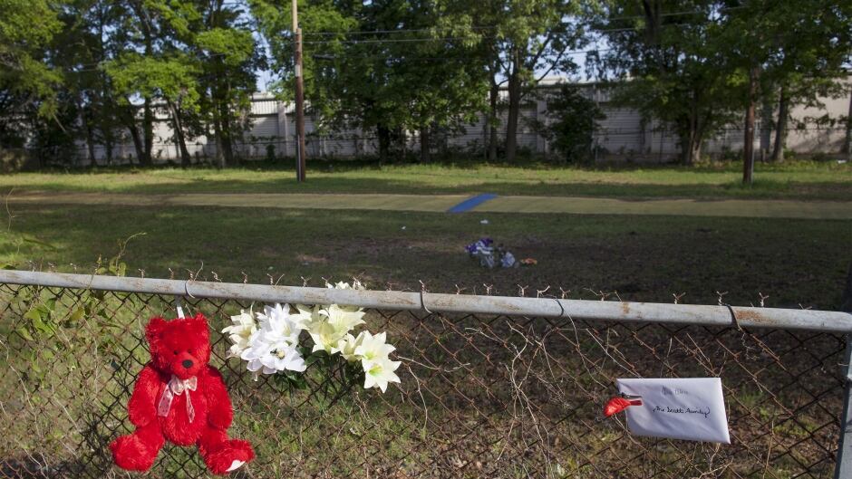 Items are displayed at a small memorial near the spot where Walter Scott was shot in North Charleston, South Carolina April 9, 2015.