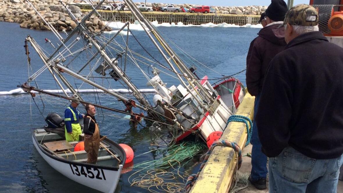 Crabladen longliner almost submerged at Lumsden wharf Newfoundland
