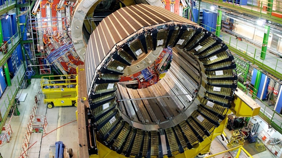 This March 22, 2007 file photo shows the magnet core of the world's largest superconducting solenoid magnet (CMS, Compact Muon Solenoid) at the European Organization for Nuclear Research (CERN)'s Large Hadron Collider (LHC) in Geneva Switzerland. The LHC is back in action after a two-year shutdown and upgrade. embarking on a new mission that scientists hope could give them a look into the unseen dark universe CERN said Sunday April 2015. (AP Photo/Keystone,Martial Trezzini, File)