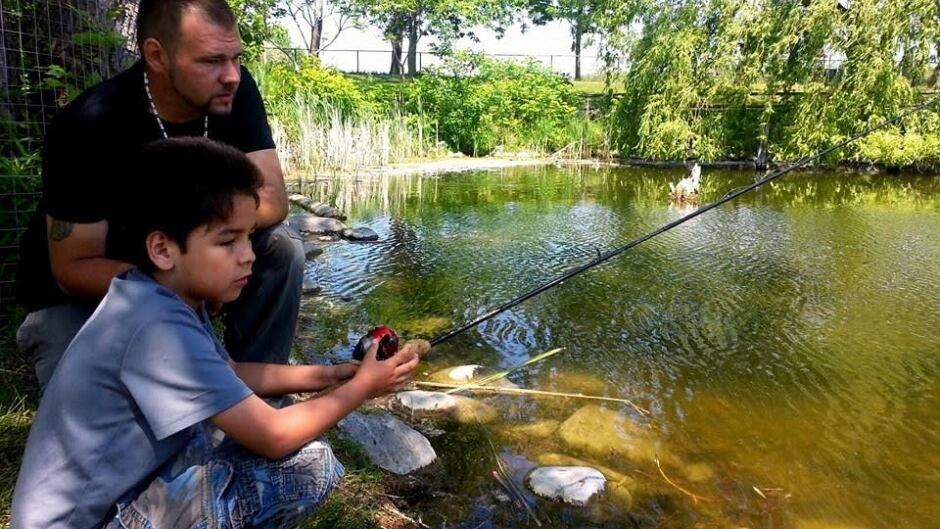 Alan Colley of Aboriginal Eco Tours with one of his fishing students.