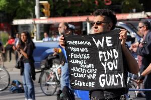 Toronto climate summit protest sign