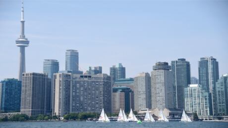 WATERFRONT PROPERTY - Sailers race in the lightning class in front of the condo-heavy Toronto skyline. (Harry How/Getty Images) City of Condos