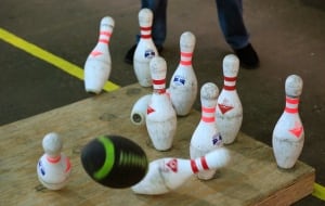 Shot of football, bowling pins in fowling facility