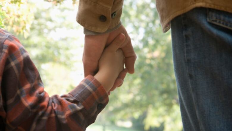 child holding hand