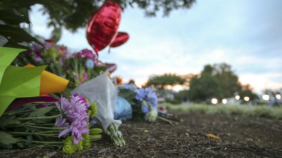 Flowers are seen at a memorial outside of the offices for WDBJ7 where slain journalists Alison Parker and Adam Ward worked in Roanoke, Virginia.