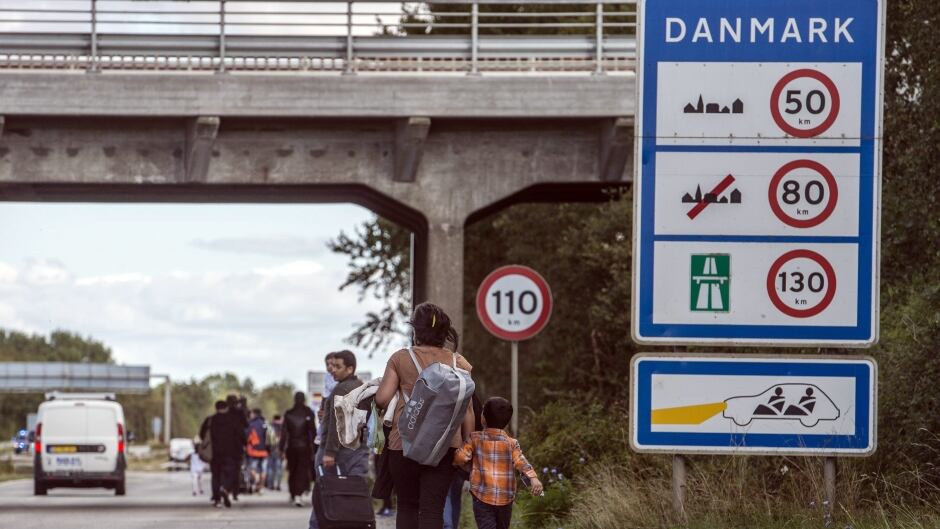 Migrants, who came from Germany by ferry and train Sunday night, walk from Rodby in southern Denmark towards Sweden on Monday Sept. 7, 2015. Most of the migrants came from Syria, and wished to continue to Sweden where they will seek asylum.